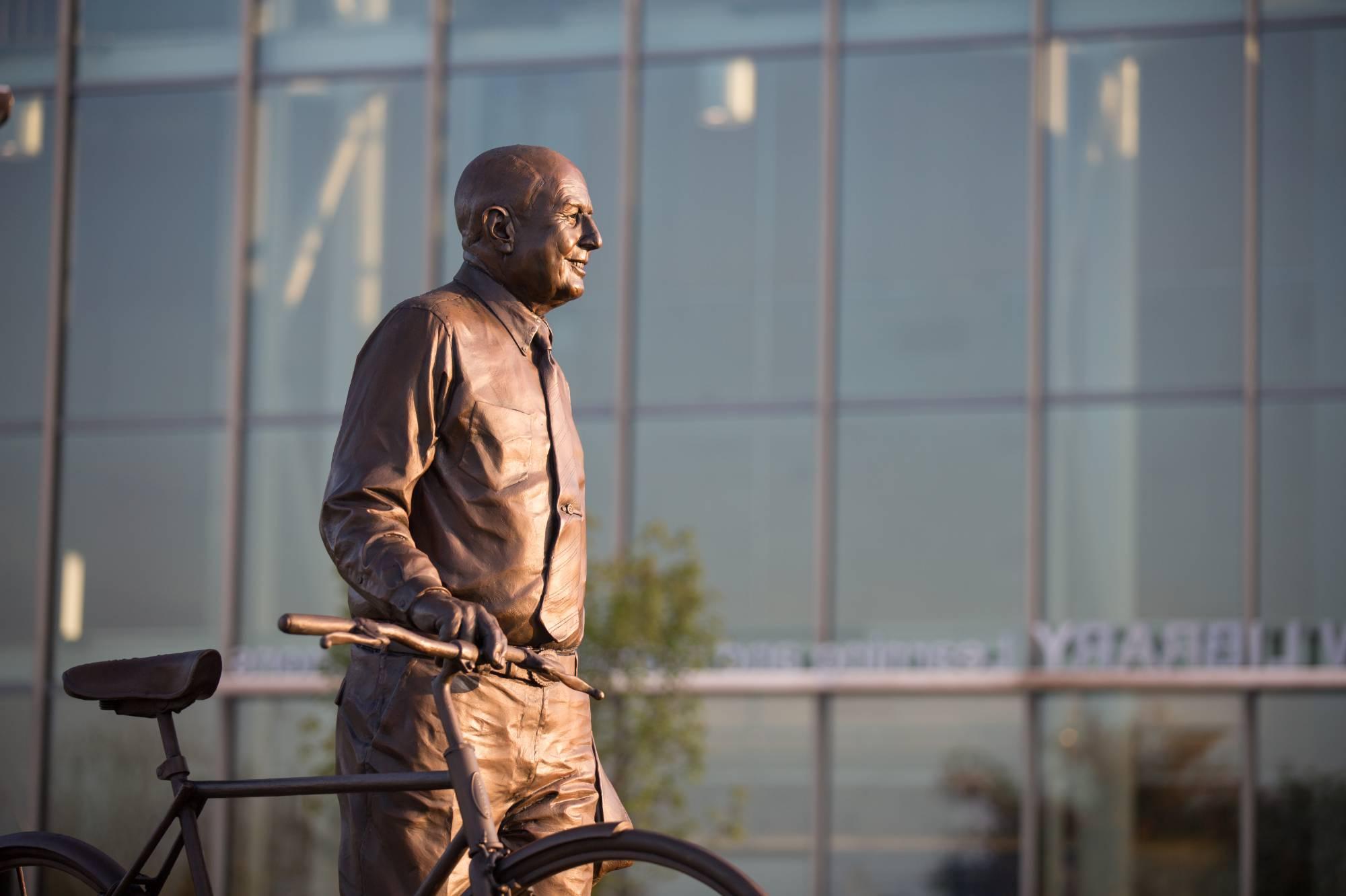 Statue of L. William Seidman with a bike